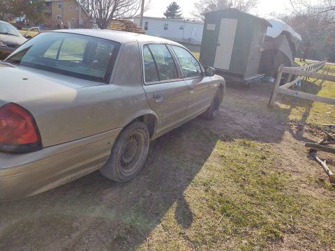 2005 Ford Crown Victoria - This 2005 Ford Crown Victoria is seen from the rear three-quarter angle in an outdoor setting.