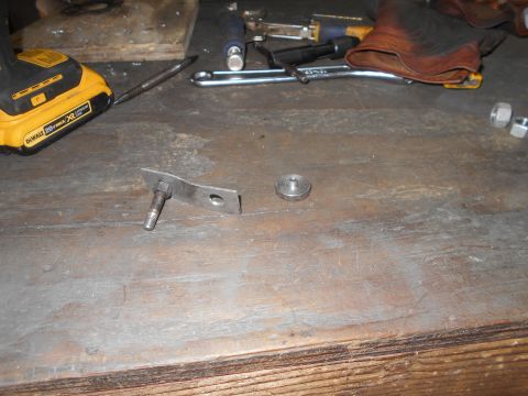 1992 Ford Bronco - Tools and hardware laid out on a workbench, including a drill, wrench, and fasteners.