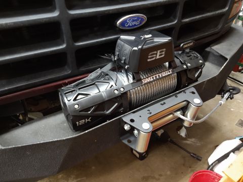 1996 Ford Bronco - A Smittybilt xrc gen 3 winch is mounted on the front bumper of a 1996 Ford Bronco.