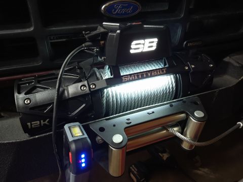 1996 Ford Bronco - Smittybilt winch installed on a Ford vehicle, with a Ford emblem visible.