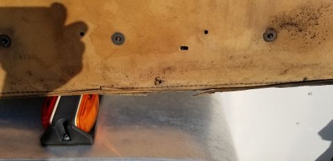 1973 Chevrolet Camaro - Close-up view of an interior door panel with an amber marker light assembly.