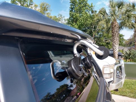 2018 Toyota 4Runner - Suction cup mounts are attached to the vehicle's window frame, with another vehicle visible in the background.