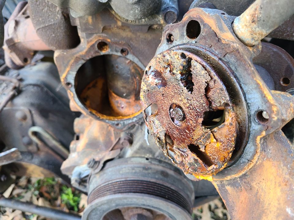 severely rusted engine water pump housing with broken impeller
