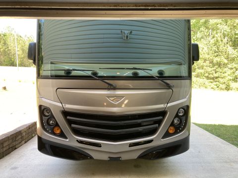 2015 Ford F-550 - Motorhome front end visible from inside a garage, showing grille and headlights.