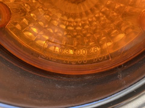 2015 Ford F-550 - Amber marker light lens shows part number L03-0026 and SAE TF 700 DOT markings.