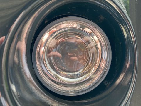 2015 Ford F-550 - A close-up view of a vehicle's fog light, showing the "TOP" indicator on the lens.