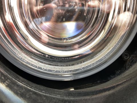 2015 Ford F-550 - Headlight lens detail with SAE HR 04 D15A text visible.