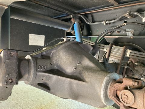2015 Ford F-550 - Close-up of the rear axle assembly and suspension parts on a heavy-duty truck.