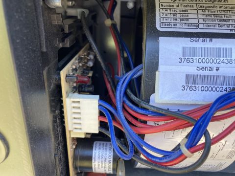 2015 Ford F-550 - The internal wiring and control board of an Atwood mobile furnace are visible.