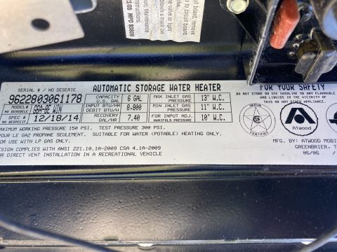 2015 Ford F-550 - Atwood RV water heater data plate showing serial number, model, capacity and gas pressure ratings.