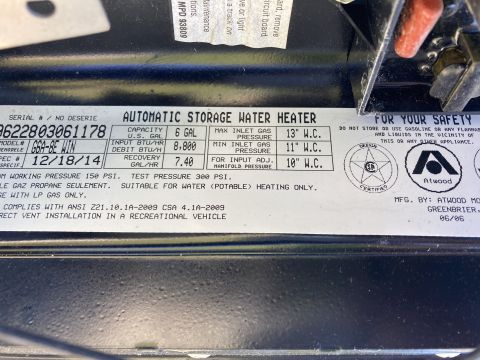 2015 Ford F-550 - Atwood RV water heater spec/data plate listing serial number, model, capacity and inlet gas pressures.