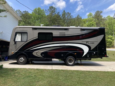 2015 Ford F-550 - This motorhome features a distinctive graphic design on its side, with the 'Flair' model name visible.