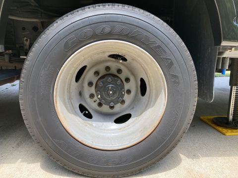 2015 Ford F-550 - A close-up view of a Goodyear tire mounted on a heavy-duty truck wheel.