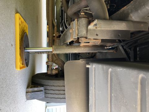2015 Ford F-550 - Close-up of vehicle suspension components and a tire.