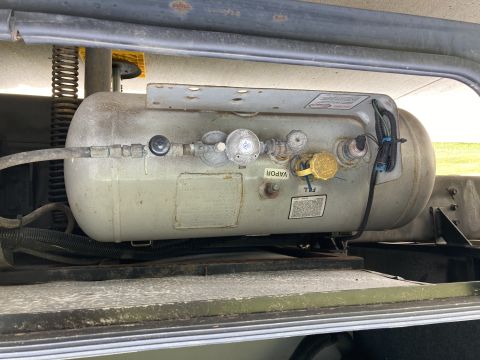 2015 Ford F-550 - A propane tank assembly is shown, with various valves and connectors.
