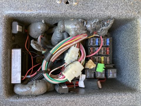 2015 Ford F-550 - A close-up view of a vehicle's electrical system, showing fuses, relays, and wiring.
