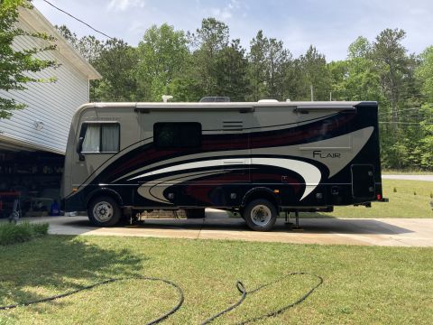 2015 Ford F-550 - This motorhome has a distinctive graphic design on its side.