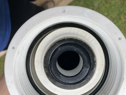 2015 Ford F-550 - Close-up of a filter housing with visible rubber seals and embossed text, not a vehicle.