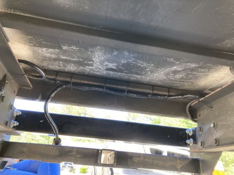 2015 Ford F-550 - Underside view of a trailer hitch with a visible wiring harness.