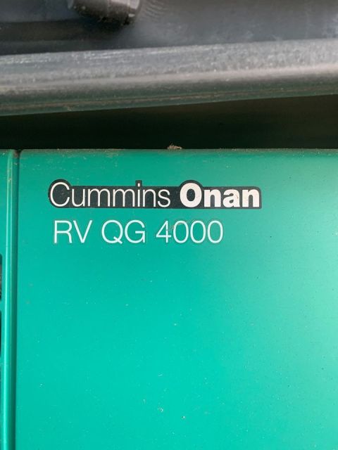 2015 Ford F-550 - Close-up of the Cummins Onan RV QG 4000 generator label, indicating its model and manufacturer.