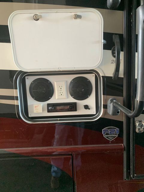 2015 Ford F-550 - This compartment on an RV contains audio equipment and power outlets, with a label indicating it is not for sale.