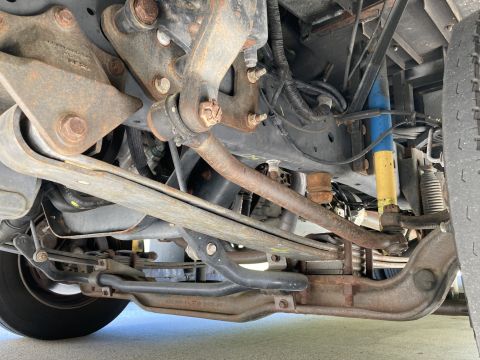 2015 Ford F-550 - The complex undercarriage of a heavy-duty truck is visible, robust suspension and steering systems.