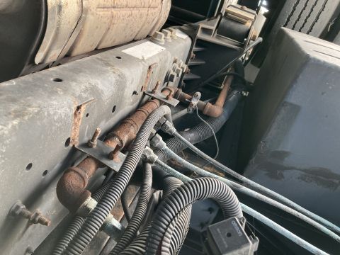 2015 Ford F-550 - Close-up view of the underbody chassis, showing various hoses, pipes, and structural components.