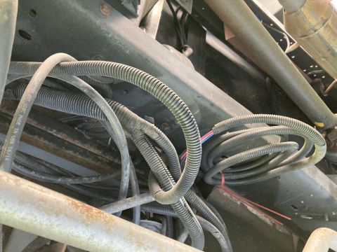 2015 Ford F-550 - Close-up view of the underbody wiring harness and frame components.