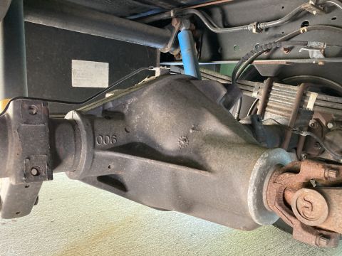 2015 Ford F-550 - Underside view of a heavy-duty truck's rear axle assembly, including the differential housing and suspension components.