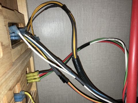 2015 Ford F-550 - Close-up of a vehicle's electrical wiring harness, showing various colored wires and connectors.