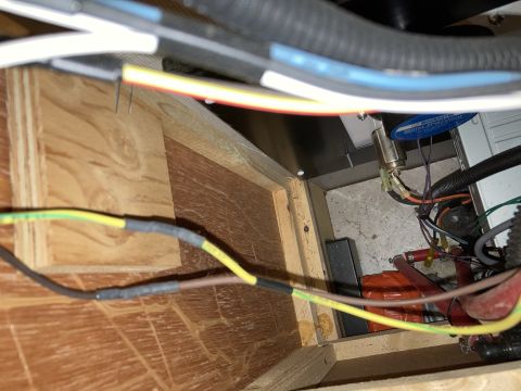 2015 Ford F-550 - Vehicle wiring and electrical components visible within a compartment, showing various wires and connections.