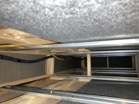 2015 Ford F-550 - Underneath view of a storage compartment showing construction and wiring.