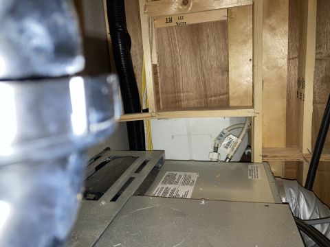 2015 Ford F-550 - Close-up view of plumbing and ducting within the interior of a vehicle, likely a recreational vehicle.