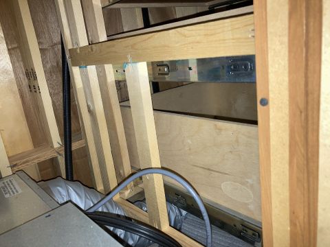 2015 Ford F-550 - Close-up of cabinet construction, revealing drawer slides and ventilation ducting.