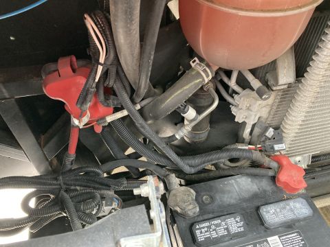 2015 Ford F-550 - Engine bay wiring and battery components are visible in this close-up view.