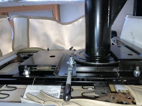 2015 Ford F-550 - Close-up of a seat swivel mechanism, likely from a recreational vehicle, showing its mechanical components.