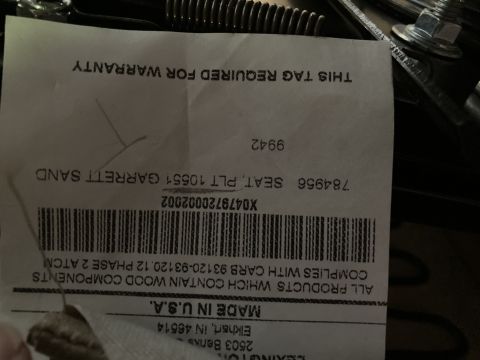 2015 Ford F-550 - Manufacturer warranty/ID spec tag for a seat assembly listing part number, barcode and compliance data.