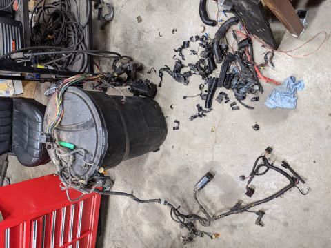 1973 Ford Bronco - Full engine bay harness from the Explorer. Starting to peel off the tape to see the rainbow inside.