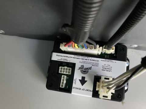 2015 Ford F-550 - A close-up view of a Power Gear leveling control module with multiple wire harness connectors and labels indicating US Patents and connecto…