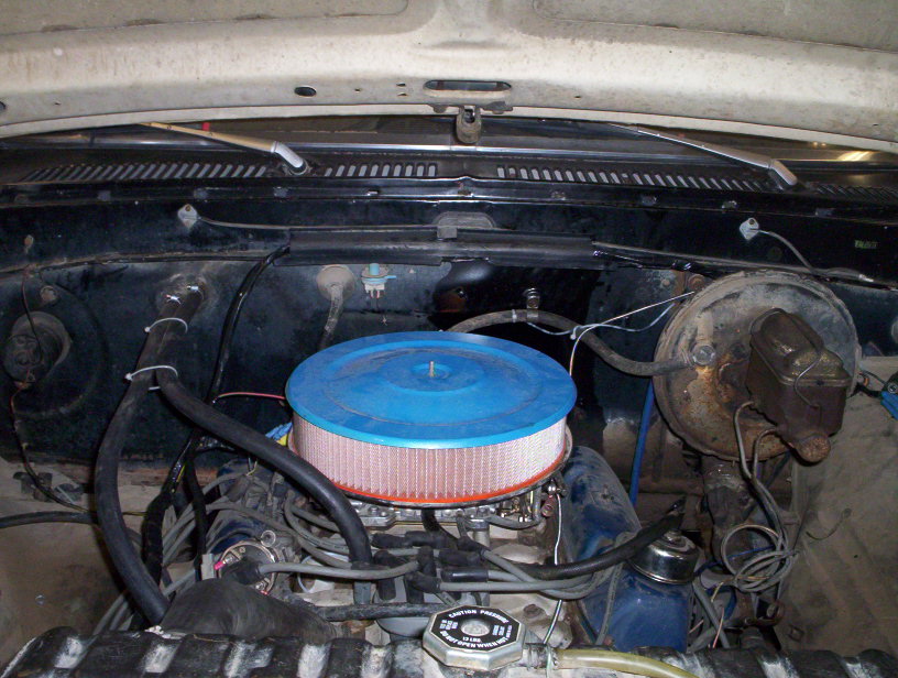 Engine bay with blue air filter and brake booster