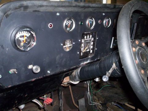 1978 Ford Bronco - The dashboard features several gauges and a steering wheel, with visible wiring underneath.
