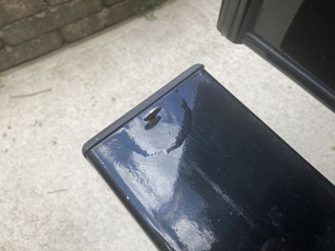 2015 Ford F-550 - A close-up view of a black metal surface with a small silver screw protruding from it. The surface appears to be part of a vehicle componen…