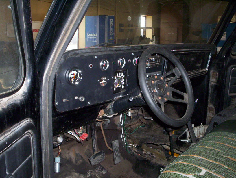1978 Ford Bronco interior with aftermarket steering wheel and gauges