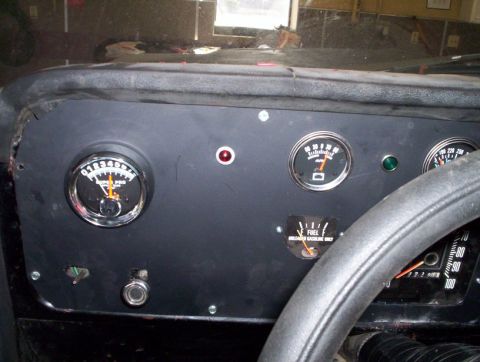 1978 Ford Bronco - Interior view of a vehicle's dashboard with multiple gauges and a steering wheel.
