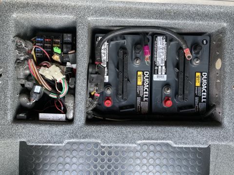 2015 Ford F-550 - Two large battery boxes are mounted on a wall, likely for a home power system.