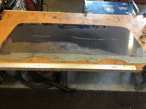 1978 Ford Bronco - Rear window glass is shown with a ruler for size reference.