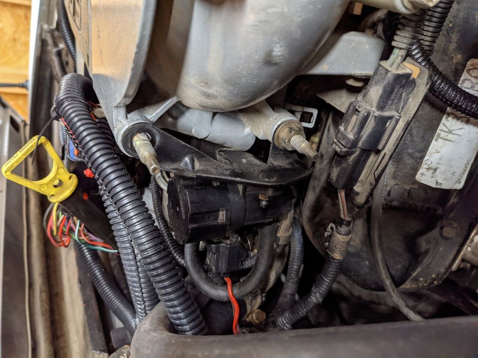 The EGR solenoid was too high (surprise, surprise... do a body lift first!) so we took the mounting bracket and flipped it 180 which moved it down plenty.  Easy.
