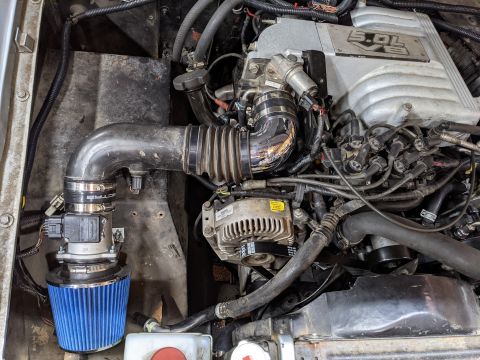 1973 Ford Bronco - We took the MAF out of the airbox and mounted it to the fender. With a little help from the heat gun the 3" Spectre intake boot slid r…