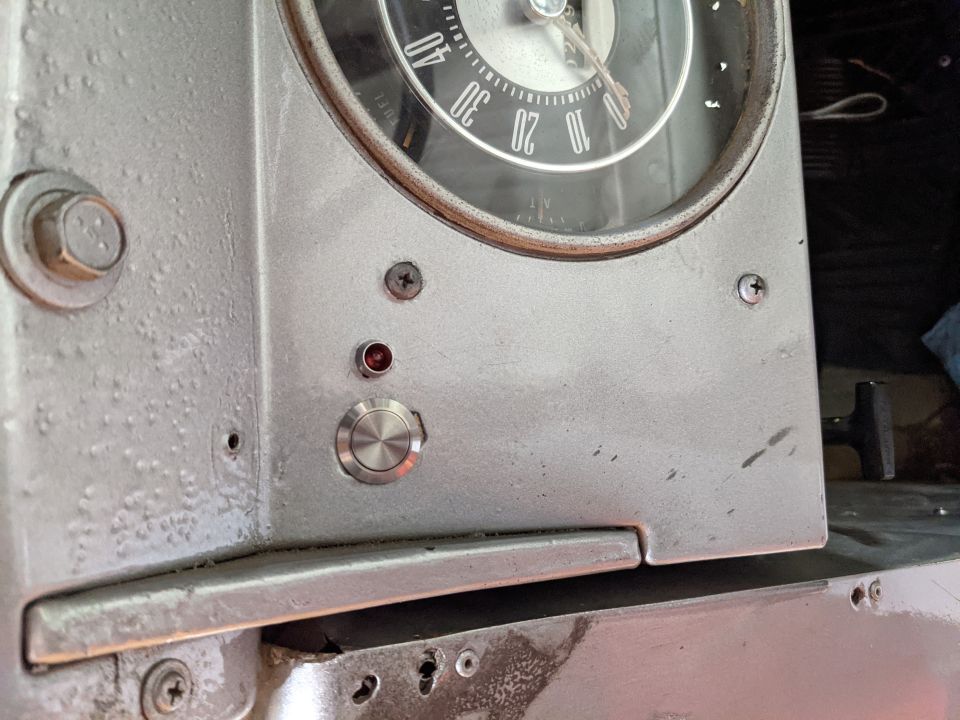 Overdrive cancel switch and LED. There was a big hole here already so in it went.  The LED has a faint glow even when not activated so a bulb indicator would be better.  A series resistor would likely also work.