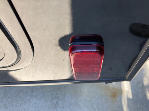 2015 Ford F-550 - Close-up of a red tail light assembly, likely from a truck or trailer.